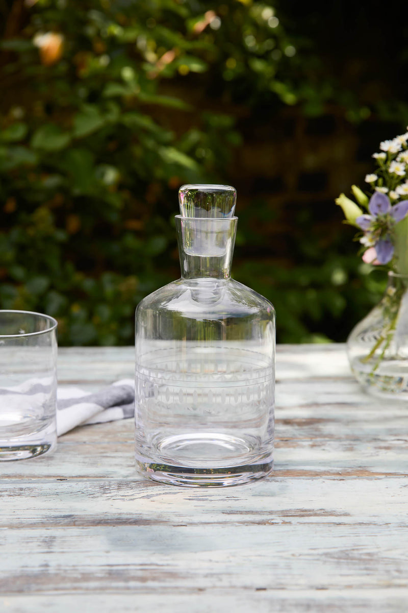 A Crystal Decanter with Ovals Design